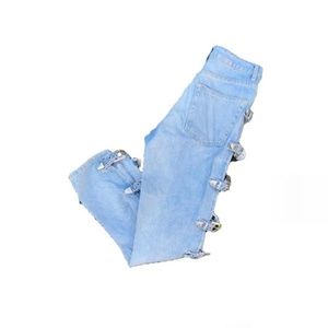 Jeans with buckle details on both the legs